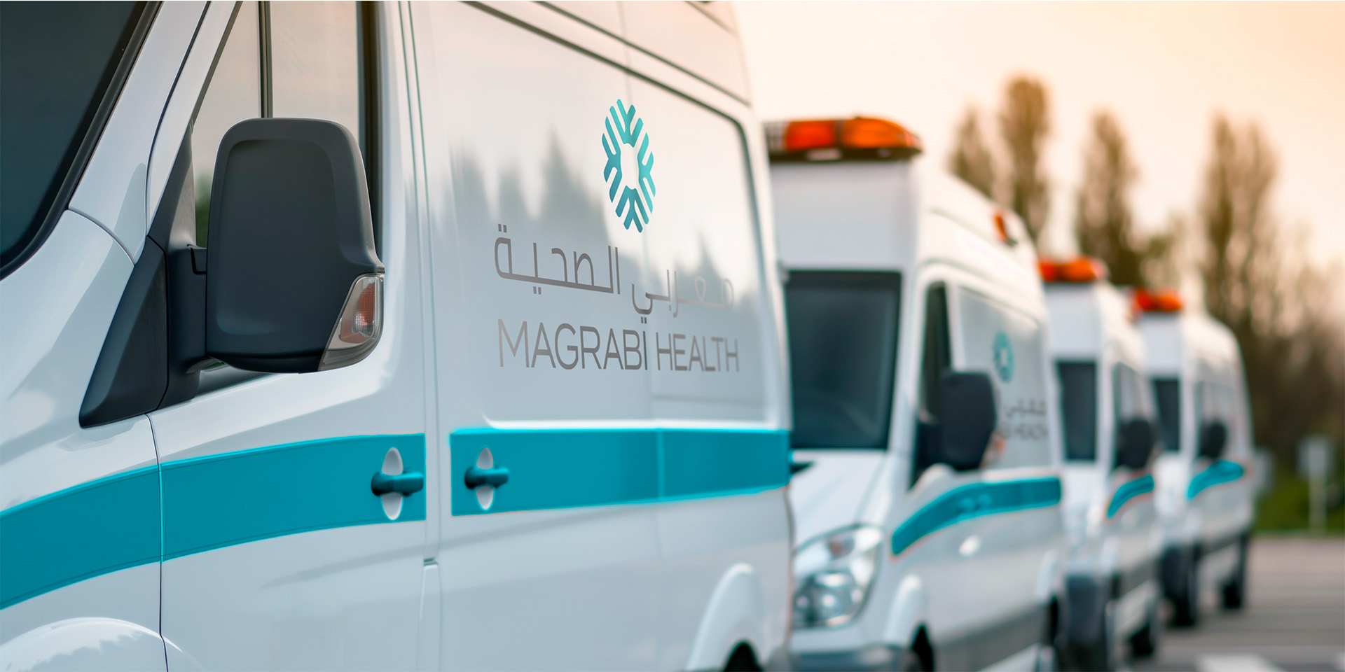 The Magrabi logo displayed on an ambulance vehicle, illustrating how the logo can be applied to brand objectives.