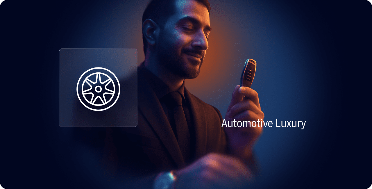 A man in a suit holds a car key fob, with a wheel icon and the words "Automotive Luxury" displayed beside him against a dark background.